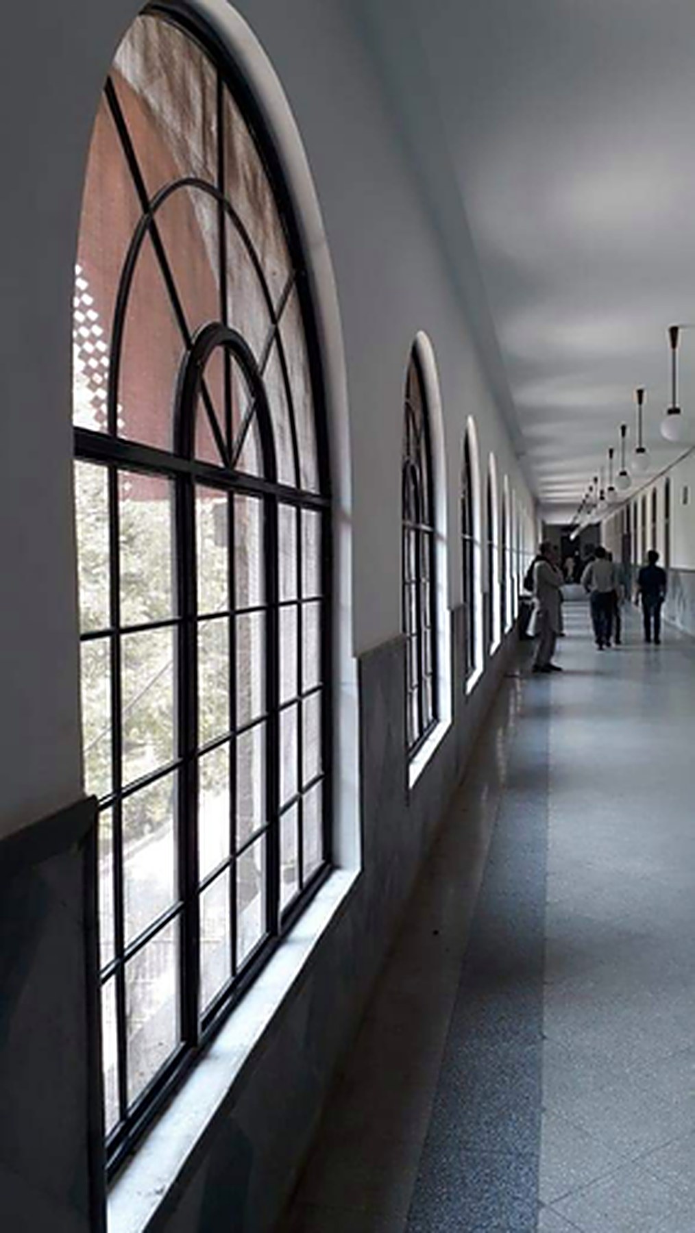 Restored corridor with arched windows at Mayo Hospital