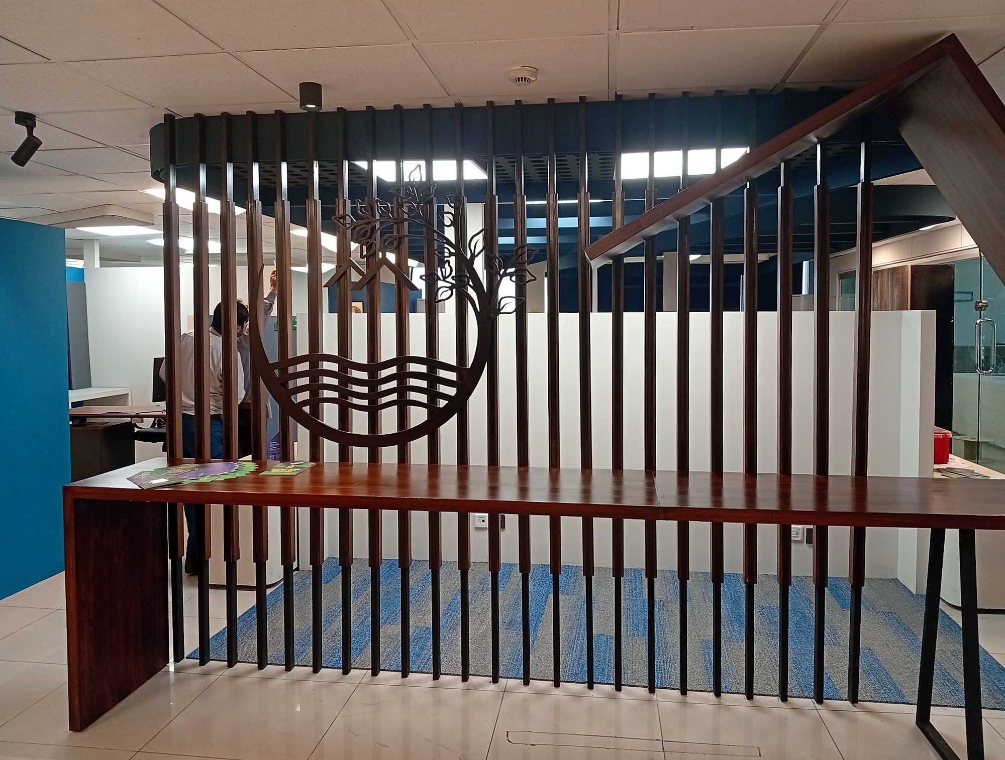 Timber slat screen with cut-out emblem